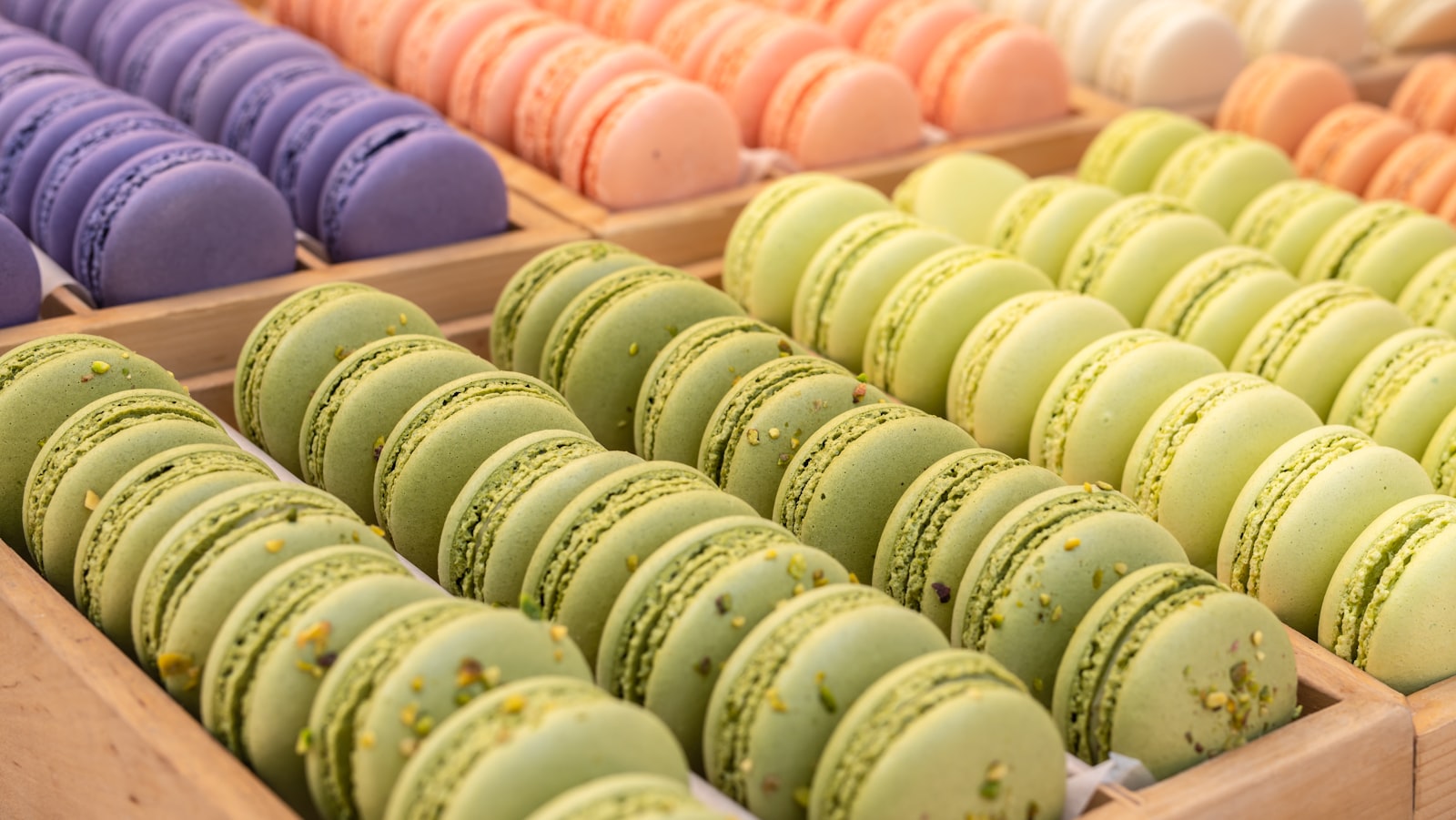Colourful French macarons and fruit tartlets
