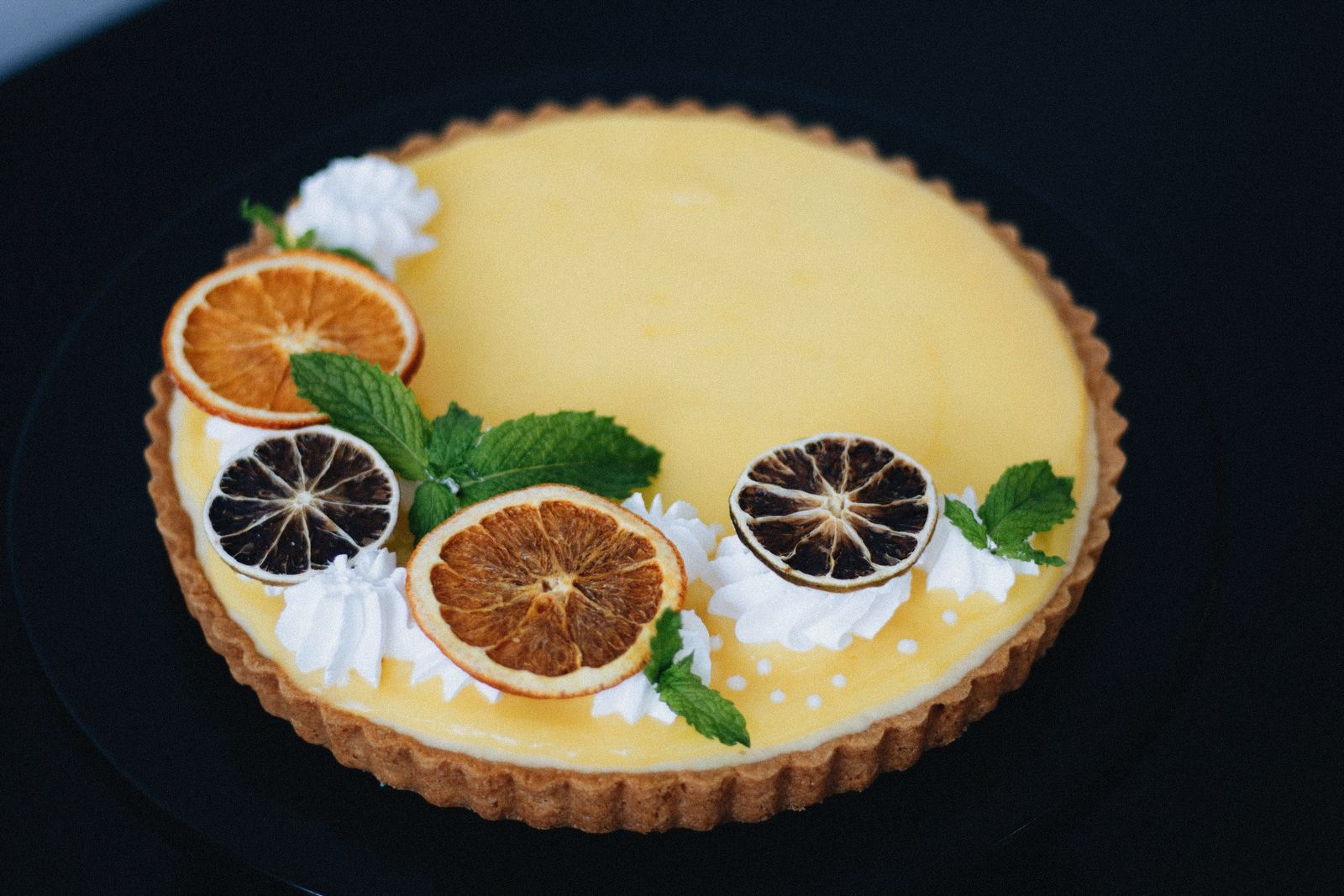 Lemon tart with dried citrus garnish