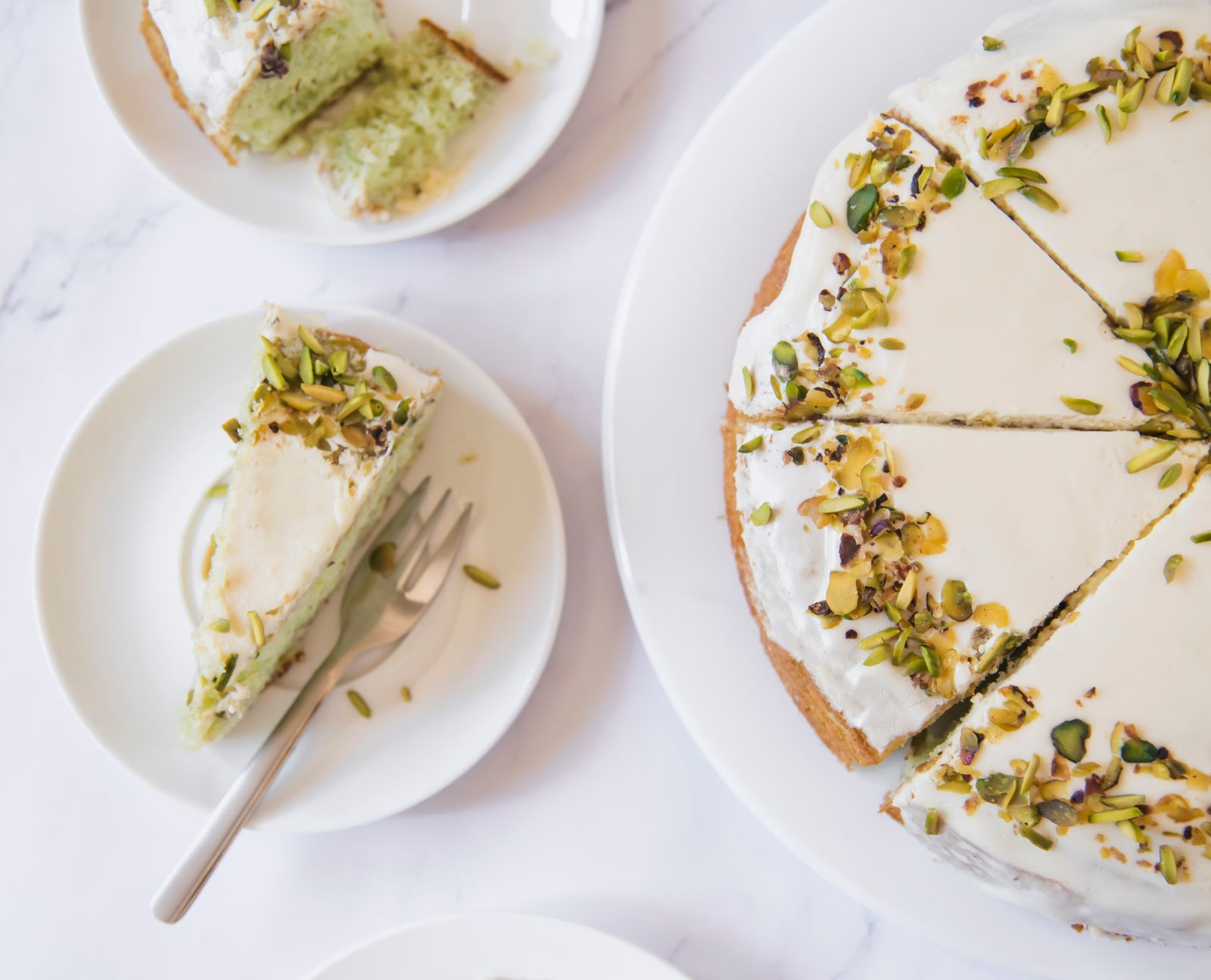 Pistachio entremet cake with crushed pistachios