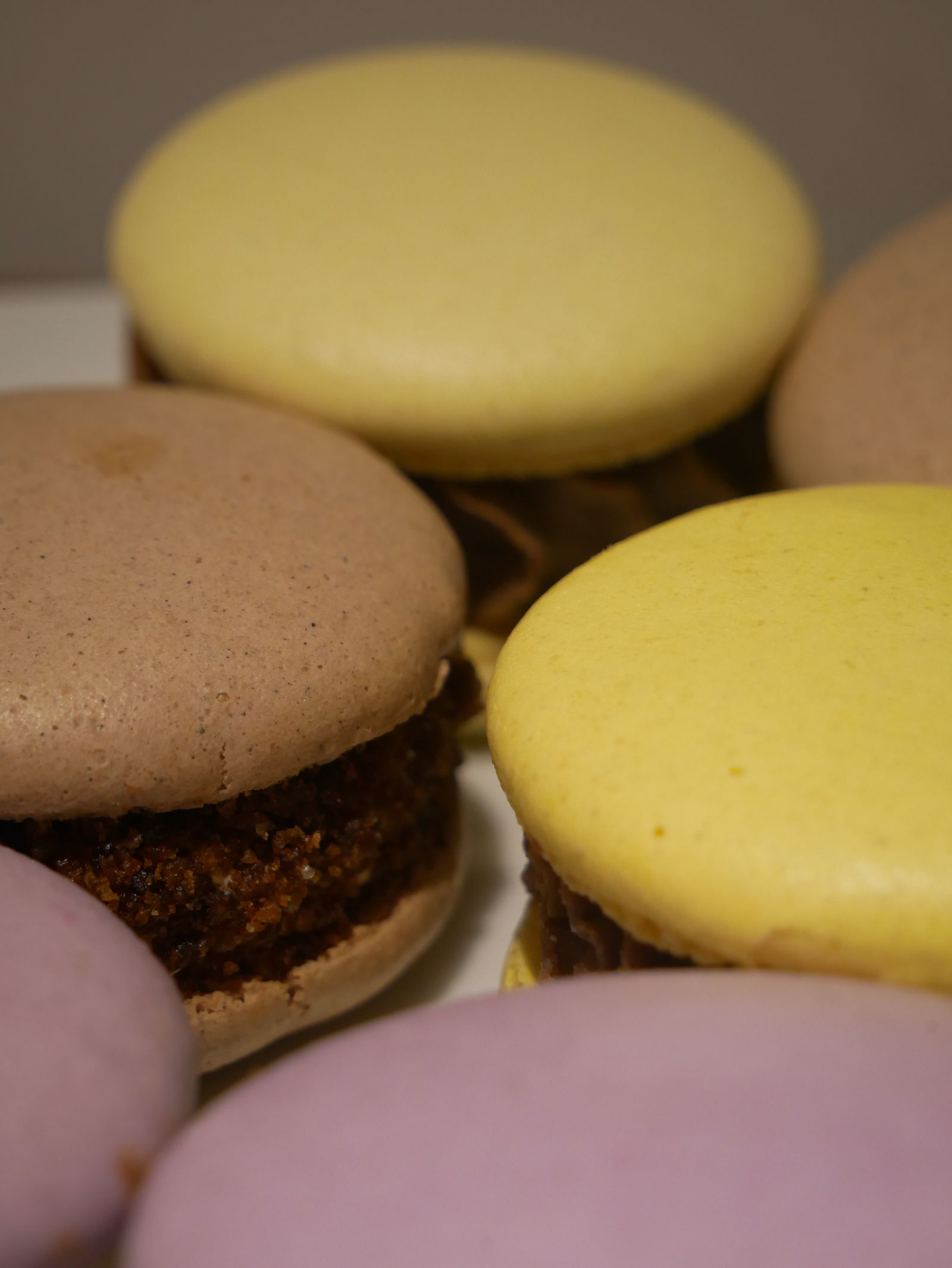 Close-up of pastel French macarons stacked together